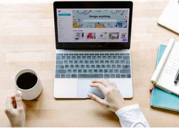 a person using the touchpad on a laptop